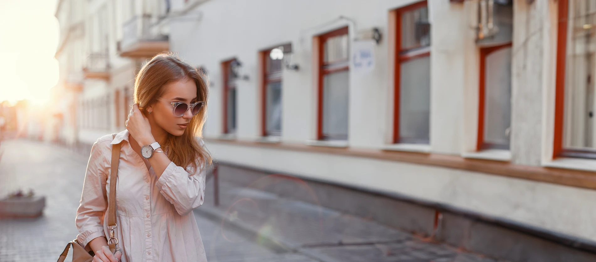 Lady next to building